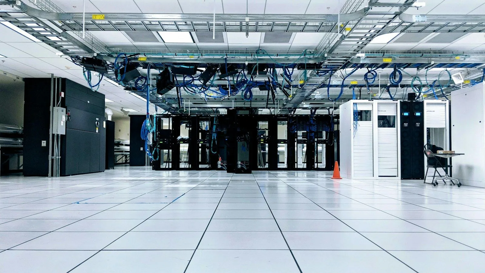 A data centre hall with rows of server racks