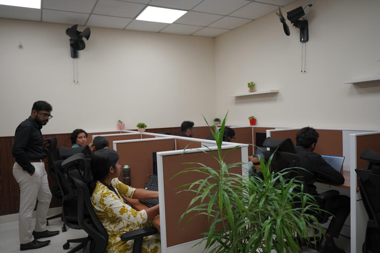 Team members at their workstations